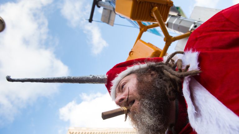 A man who identified himself as Santa Unicorn, 45, participates in SantaCon in Manhattan on Dec. 10, 2016. 