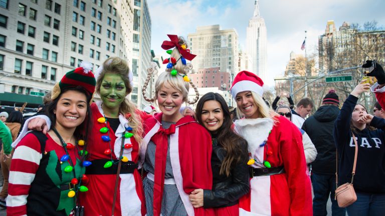 People dressed as Santas gather for the start of SantaCon on East 23rd Street and Broadway in Manhattan on Dec. 10, 2016.