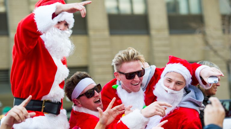 People dressed as Santas gather for the start of SantaCon on East 23rd Street and Broadway in Manhattan on Dec. 10, 2016.