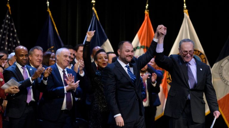 Corey Johnson commits to a city for middle-class at inauguration 1 Council Speaker Corey Johnson and Sen. Charles Schumer celebrate during Johnson's inaguration Sunday.