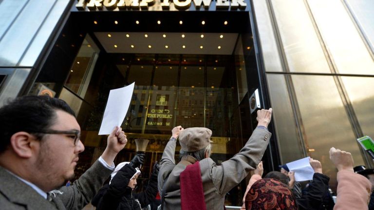 Dozens of people involved in a Silent Peace March pause in front of Trump Tower on Saturday, Feb. 18, 2017. 75 years ago, President Franklin D. Roosevelt signed executive order 9066 in 1942 which authorized the U.S. military to remove 120,000 people of Japanese descent, from their homes on the west coast to inland concentration camps. Most were U.S. citizens at the time of their internment. To commemorate the day and to show solidarity with Muslim Americans who fear being banned from the U.S., dozens of people walked from Columbus Circle to the Japanese American Church on 7th Ave. where they were met by internment survivors.