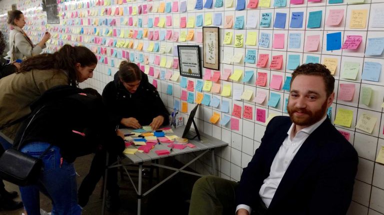 Adam Shorr, 27, of Brooklyn, helped hand out materials to people who wanted to share their feelings.