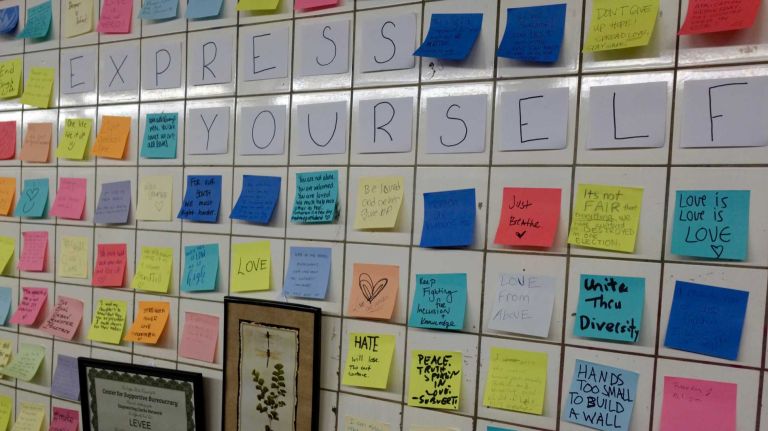 A message on the wall beckoned straphangers: 