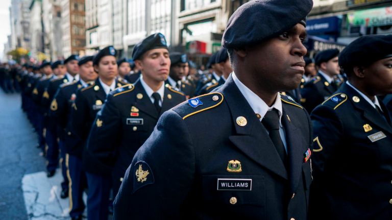 Members of the Harlem Hellfighters (Army) stand at attention on Fifth Avenue during the Veterans Day Parade in Manhattanon Friday, Nov. 11, 2016.