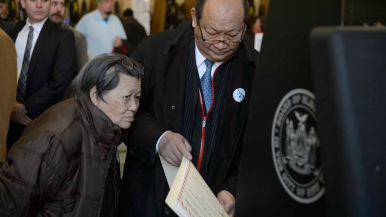 Voters cast their ballots at St. Sebastian's School in Woodside, Queens, on Nov. 8, 2016.