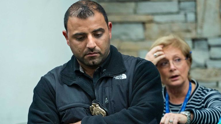 Bronx police shooting: Photos from the scene and more 33 An NYPD officer stands in a lobby of the Jacobi Medical Center in the Bronx on Friday, Nov. 4, 2016, after news circulated that Sgt. Paul Tuozzollo, of Huntington, had died and another officer, Sgt. Emmanuel Kwo, had been wounded in a shootout with a suspect who was killed.