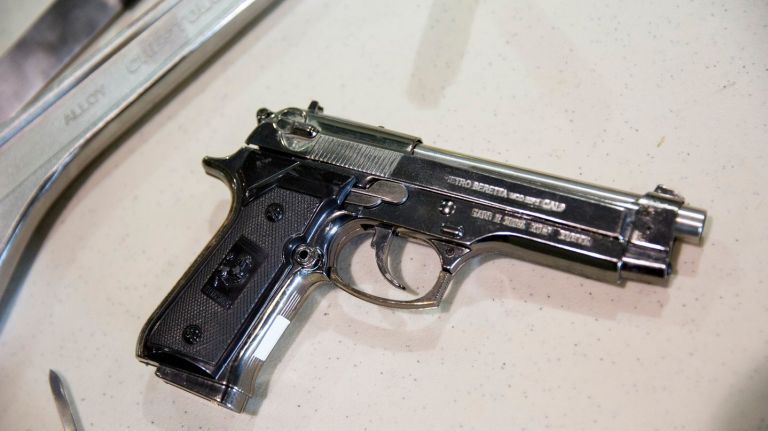 Anything that even resembles a gun isn't going to make it past security. A real, unloaded gun can be put in your checked bags as long they're in a hard-sided container and you tell the airline about them. Replica firearms can go in your checked bag too. 