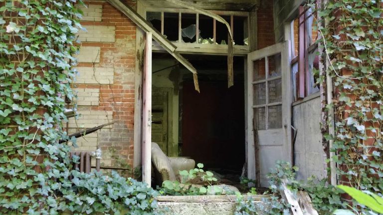 There's even some furniture left behind, like this chair abandoned in a doorway.
