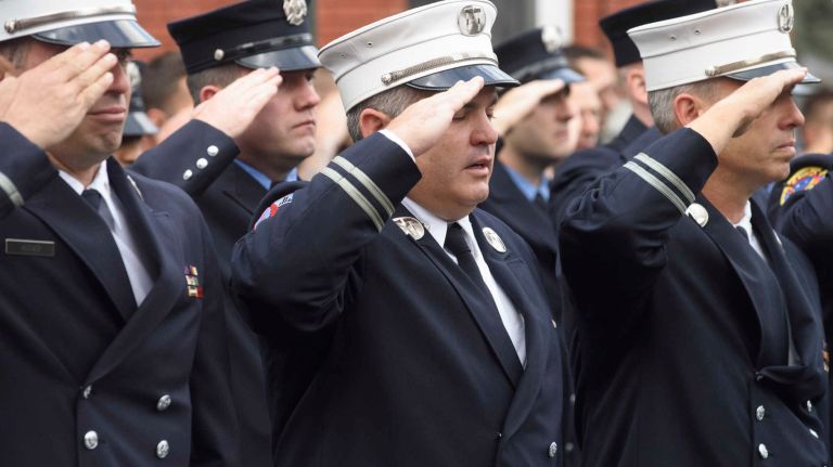 FDNY Battalion Chief Michael Fahy honored at bunting ceremony: See photos 7 The FDNY's Lt. John Paul Augier, left, and Capt. Brendan Dehaan, center, friends of Fahy, salute the fallen firefighter on Wednesday, Sept. 28, 2016.