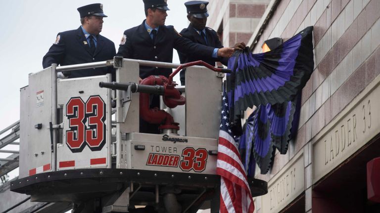FDNY Battalion Chief Michael Fahy honored at bunting ceremony: See photos 8 FDNY members hang bunting at Battalion 19 in honor of Fahy on Wednesday, Sept. 28, 2016.