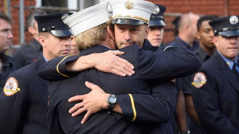 FDNY Battalion Chief Michael Fahy honored at bunting ceremony: See photos 9 Members of the FDNY hug at a bunting ceremony for Fahy on Wednesday, Sept. 28, 2016.