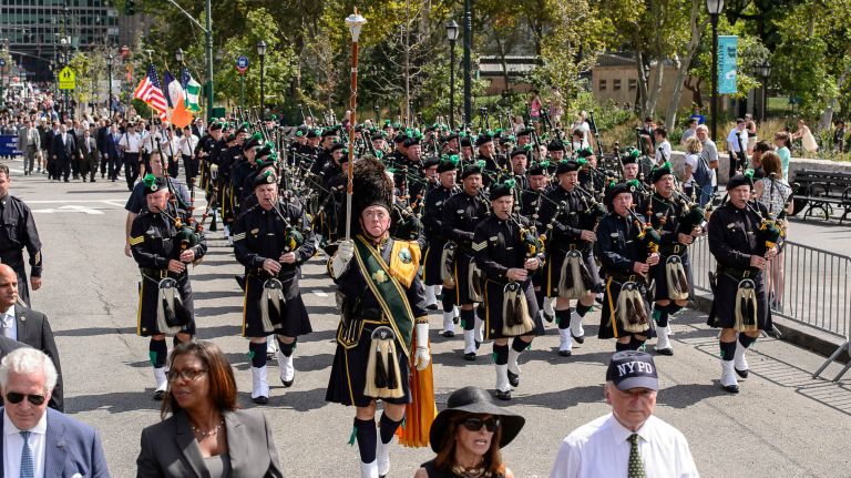 Pipers march in the parade and ceremony on Friday, Sept. 9, 2016, to honor NYPD officers who died in the 9/11 terror attacks.