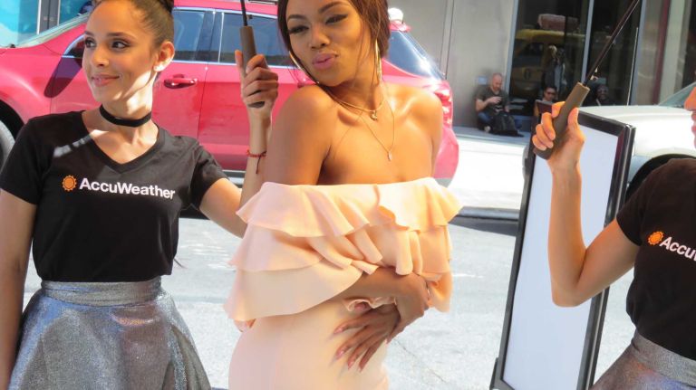 South African TV personality Bonang Matheba strikes a pose before the Vera Wang show at the Skylight at Moynihan Station in Manhattan during New York Fashion Week on Tuesday, Sept. 13, 2016.