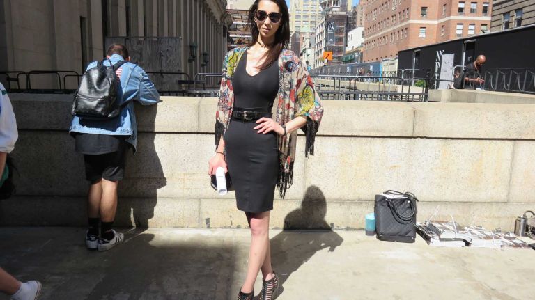 Christina Metauro poses outside the Vera Wang show at the Skylight at Moynihan Station in Manhattan during New York Fashion Week on Tuesday, Sept. 13, 2016.
