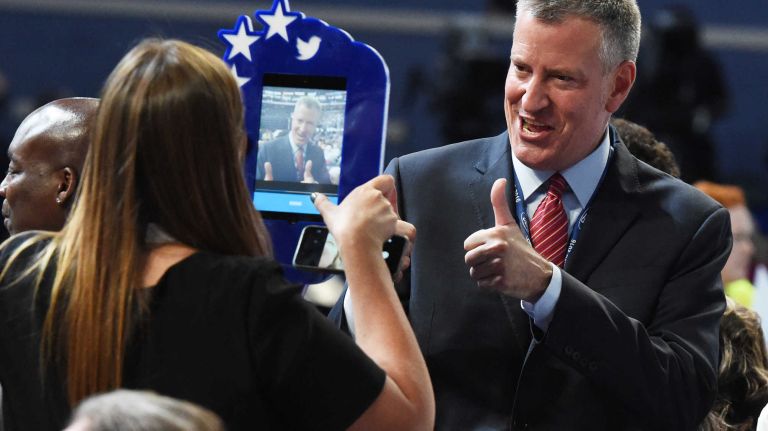 Mayor Bill de Blasio stops for a photo on the floor at the Democratic National Convention at the Wells Fargo Center in Philadelphia on Monday, July 25, 2016.