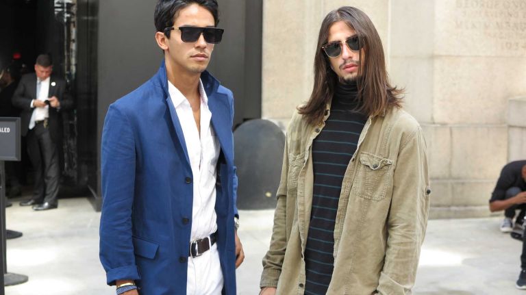 Guests show off their street style outside the Michael Costello show during New York Fashion Week at the Skylight at Moynihan Station in Manhattan on Thursday, Sept. 8, 2016.