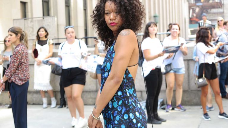 A guest shows off her street style outside the Michael Costello show during New York Fashion Week at the Skylight at Moynihan Station in Manhattan on Thursday, Sept. 8, 2016.