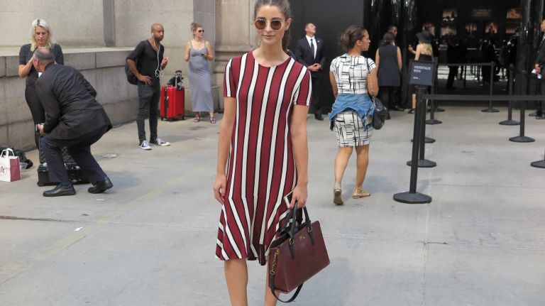 A guest outside the Michael Costello show during New York Fashion Week at the Skylight at Moynihan Station in Manhattan on Thursday, Sept. 8, 2016.