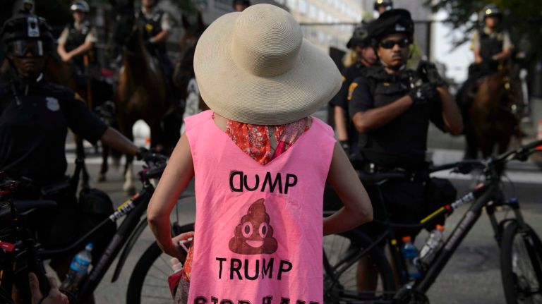 Anti-Trump protestors march through downtown Cleveland the day before the start of the Republican National Convention in Cleveland, Ohio, Sunday, July 17, 2016.