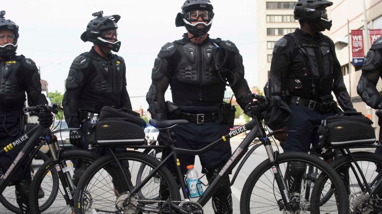 Police block access to certain areas as anti-Trump protestors march through downtown Cleveland the day before the start of the Republican National Convention in Cleveland, Ohio, Sunday, July 17, 2016.