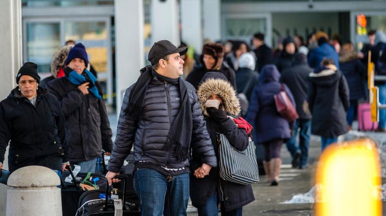 JFK water pipe bursts, disrupting international flights, spurring on investigation 1 Passengers exit after a water pipe ruptured in Terminal 4 at JFK airport, Sunday, Jan. 7.
