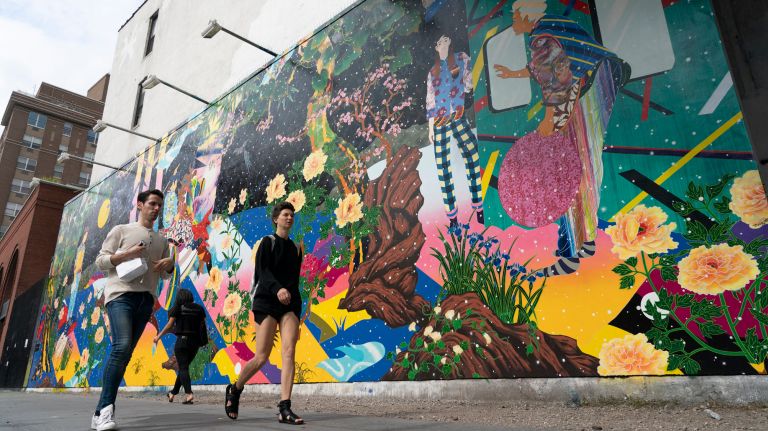 Pedestrians pass by a new mural by Brooklyn-based Japanese artist Tomokazu Matsuyama on Houston Street.