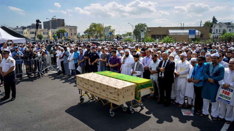 Hundreds stand in prayer during a service known as a Janaza for slain Imam Maulama Akonjee and his associate Thara Uddin in Ozone Park, Queens, on Monday, Aug. 15, 2016.