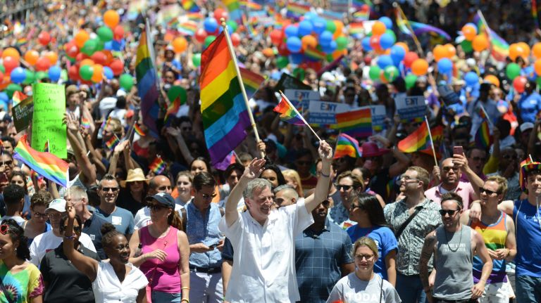 Mayor Bill deBlasio and first lady Chirlane McCray welcome participants marching down Fifth Avenue during the city's annual LGBTQ Pride March on Sunday, June 25, 2017.