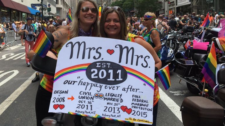NYC Pride March participants Carolyn and Beth pose for a photo on Fifth Avenue in Manhattan on Sunday, June 25, 2017.
