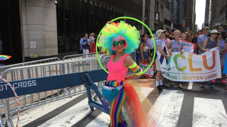 A NYC Pride March participant sports a colorful outfit while walking on Fifth Avenue in Manhattan on Sunday, June 25, 2017.