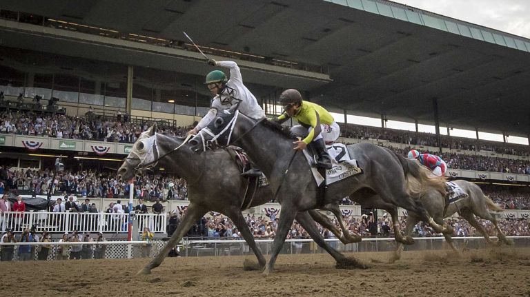 Jockey Irad Ortiz, Jr with a thumbs up and a victory smile after riding Creator to win The Running of the 148th Belmont Stakes at Belmont Park Elmont June 11, 2016.