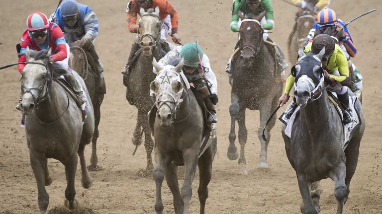 Jockey Irad Ortiz, Jr riding Creator, center in white, winning The Running of the 148th Belmont Stakes at Belmont Park Elmont June 11, 2016.