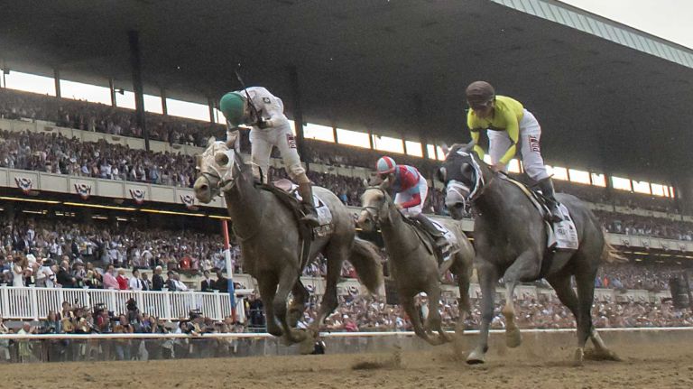 Creator's jockey Irad Ortiz, Jr. winning The Running of the 148th Belmont Stakes at Belmont Park Elmont June 11, 2016.