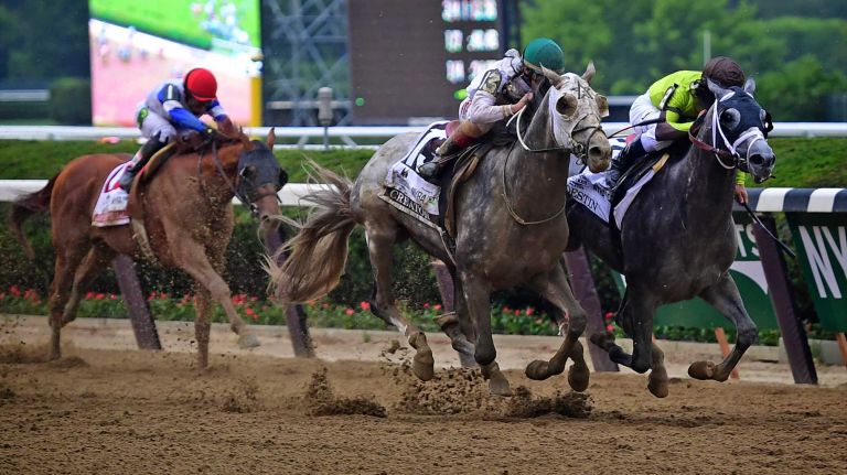 Creator (13) runs neck and neck with Destin (2) down the back stretch to during the 148th running of the Belmont Stakes at Belmont Park in Elmont on June 11, 2016.
