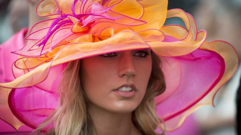Tayler Hartwell, of Bristol, Conn., takes in the races and festivities on June 11, 2016, in Belmont Park in Elmont before the running of the 148th Belmont Stakes.