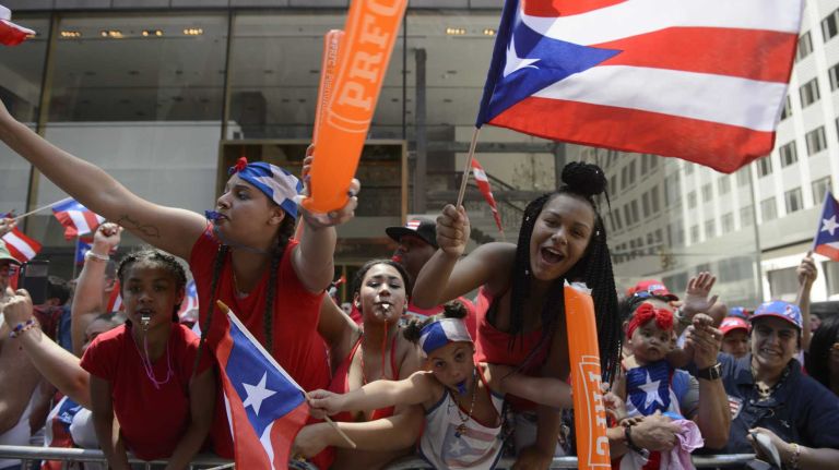 Puerto Rican Day Parade 2016 held in NYC: See photos from the Fifth Avenue festivities 37 Spectators lining Fifth Avenue celebrate during the Puerto Rican Day Parade in Manhattan on Sunday, June 12, 2016.