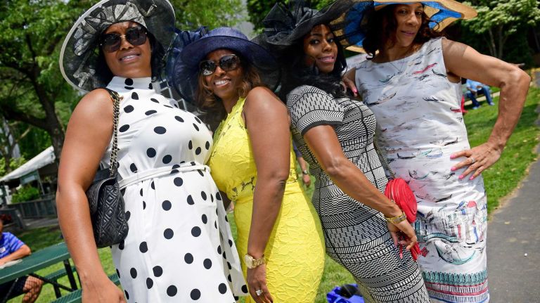 Race fans, from left, Kelly Brown, Delia Becca, Nikki Thompson and Dawny Thompson, all of New Jersey, show off their race day outfits on Saturday, June 11, 2016, at Belmont Park in Elmont. They were at the track for the 148th running of the Belmont Stakes.