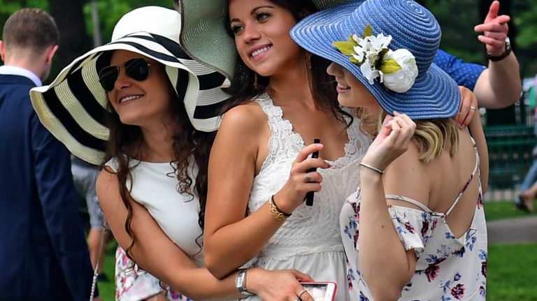 Race fans, from left, Nicole Aronson, Sarah Bertin, and Mackenzie Phaneuf show off their race day outfits on Saturday, June 11, 2016, at Belmont Park in Elmont. They were at the track for the 148th running of the Belmont Stakes.
