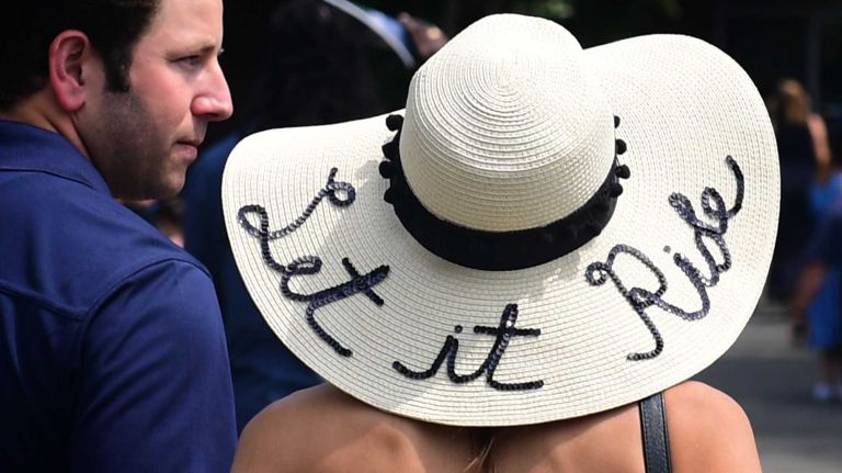 Belmont Stakes day at the track in Elmont are a chance to wear hats, both wonderful and wacky. These race fans are at the track on Saturday, June 11, 2016.