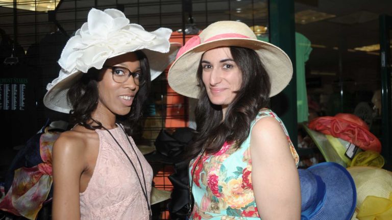 Roejendra Adams, left, and Carol Sulla arrive with fine hats on June 11, 2016, for the 148th running of the Belmont Stakes at Belmont Park in Elmont.