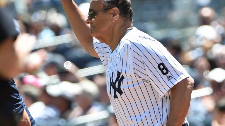 Former New York Yankees manager Joe Torre tips his cap to fans during the 70th annual Old-Timers' Day at Yankee Stadium on Sunday, June 12, 2016.