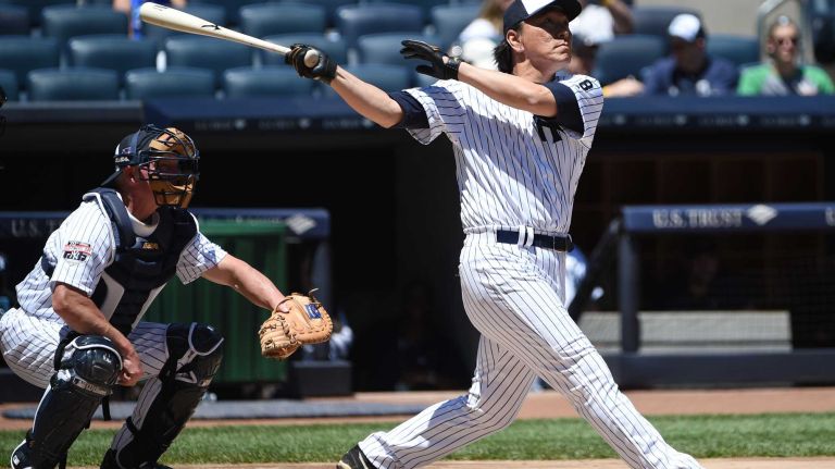 Former New York Yankees player Hideki Matsui hits a two-run home run during the 70th annual Old-Timers' game at Yankee Stadium on Sunday, June 12, 2016.