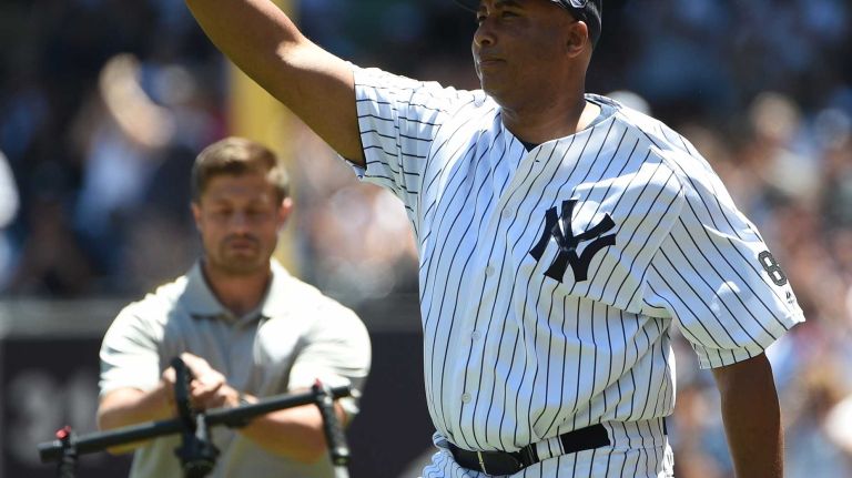 Former New York Yankees player Bernie Williams waves to fans during the 70th annual Old-Timers' Day at Yankee Stadium on Sunday, June 12, 2016.