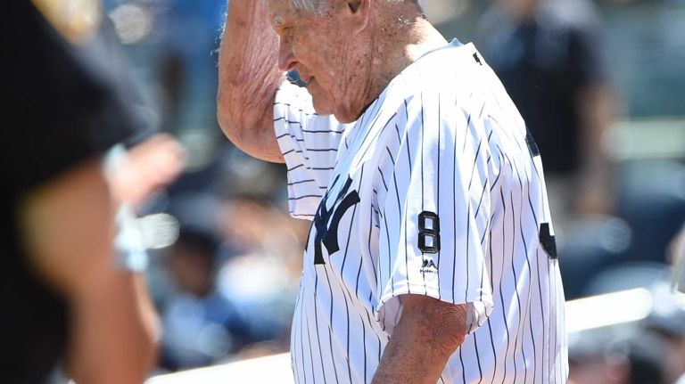 Former New York Yankees player Eddie Robinson tips his cap to fans during the 70th annual Old-Timers' Day at Yankee Stadium on Sunday, June 12, 2016.