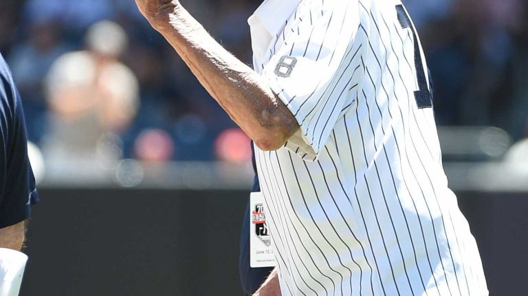 Former New York Yankees player Don Larsen tips his cap to fans during the 70th annual Old-Timers' Day at Yankee Stadium on Sunday, June 12, 2016.