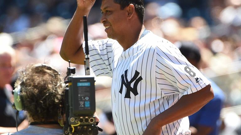 Former New York Yankees player Ramiro Mendoza tips his cap to fans during the 70th annual Old-Timers' Day at Yankee Stadium on Sunday, June 12, 2016.