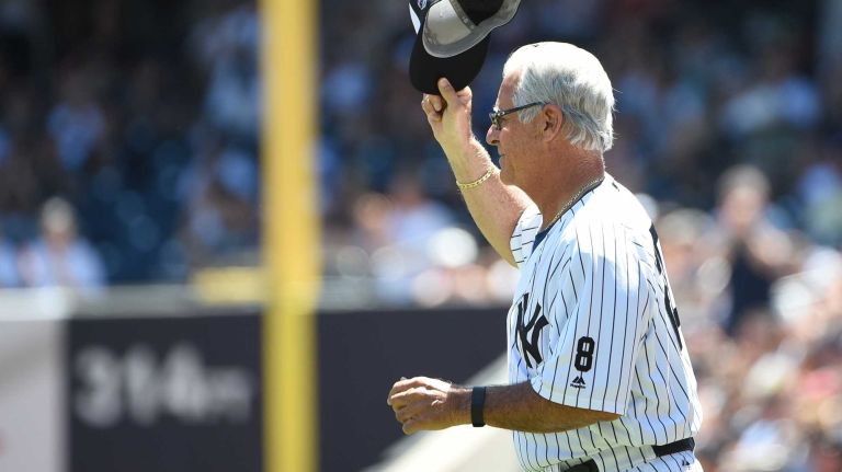 Former New York Yankees player Bucky Dent tips his cap to fans during the 70th annual Old-Timers' Day at Yankee Stadium on Sunday, June 12, 2016.