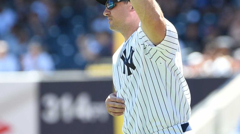 Former New York Yankees player Bubba Crospy waves to fans during the 70th annual Old-Timers' Day at Yankee Stadium on Sunday, June 12, 2016.