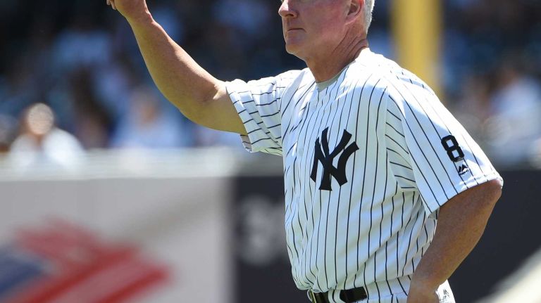 Former New York Yankees player Scott Bradley tips his cap to the fans during the 70th annual Old-Timers' Day at Yankee Stadium on Sunday, June 12, 2016.
