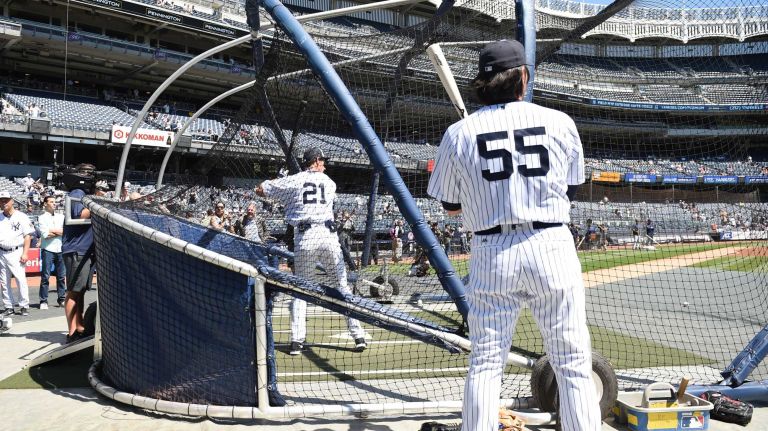 Former New York Yankees player Paul O'Neill takes batting practice while former Yankees' Hideki Matsui looks on during the 70th annual Old-Timers' Day at Yankee Stadium on Sunday, June 12, 2016.